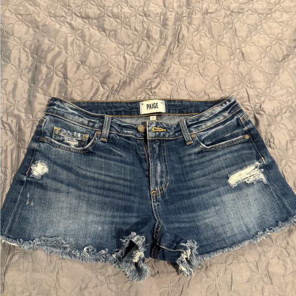 PAIGE Blue Jean Shorts with Distressed Cut-Off Style